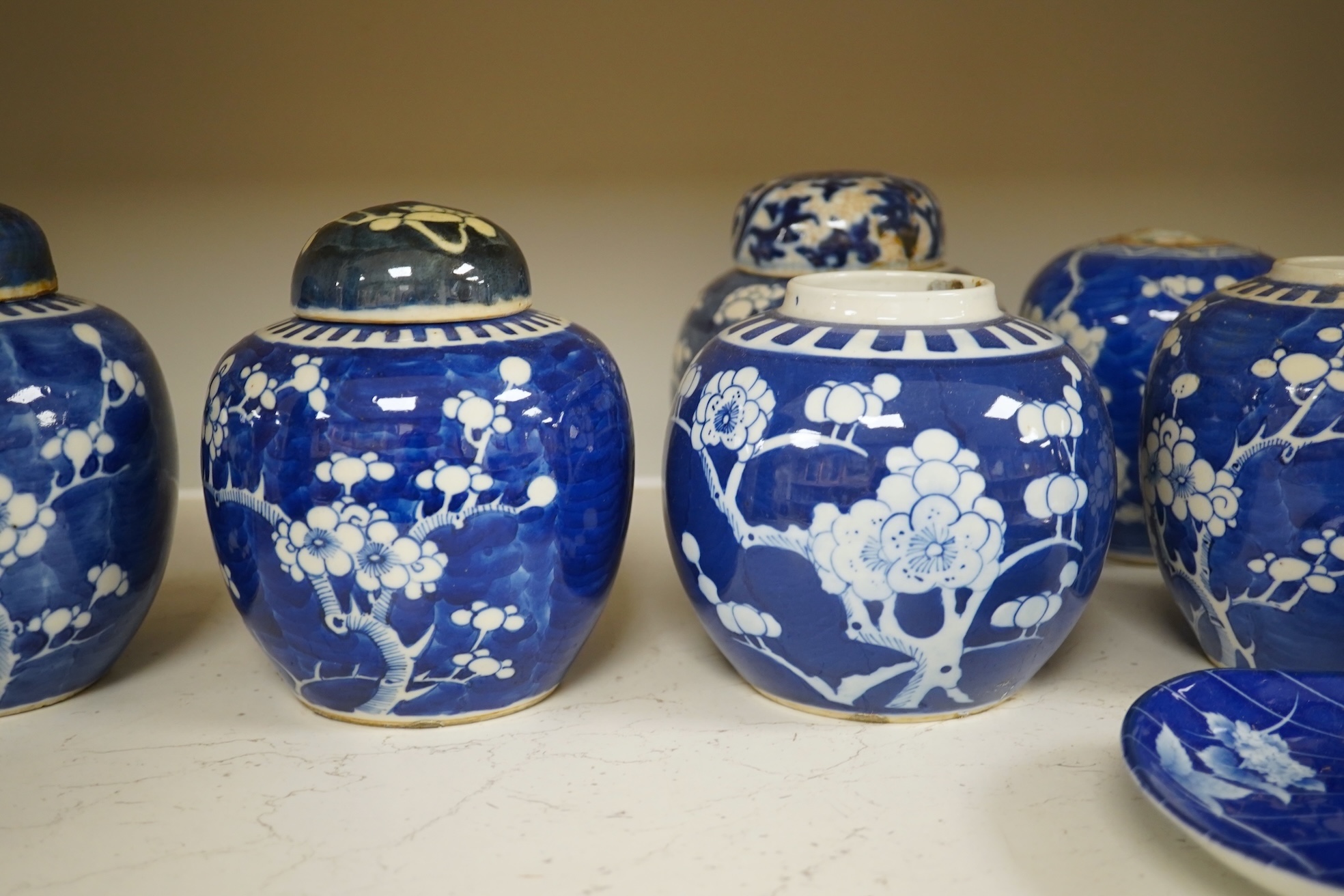 Eight Chinese blue and white ginger jars, one prunus vase and two others, the vase 25cm high. Condition - varies